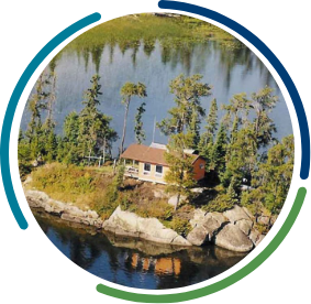 Cabin surrounded by trees on a small island