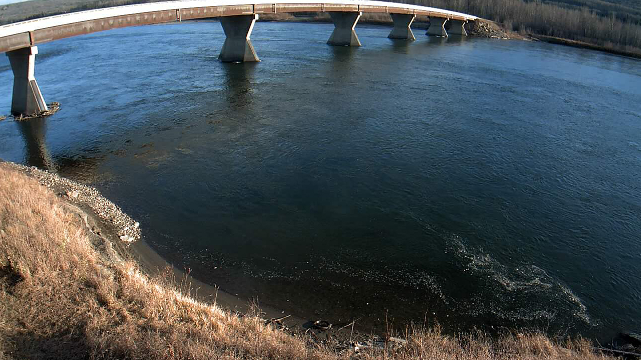 Monitoring water levels near bridge over a river